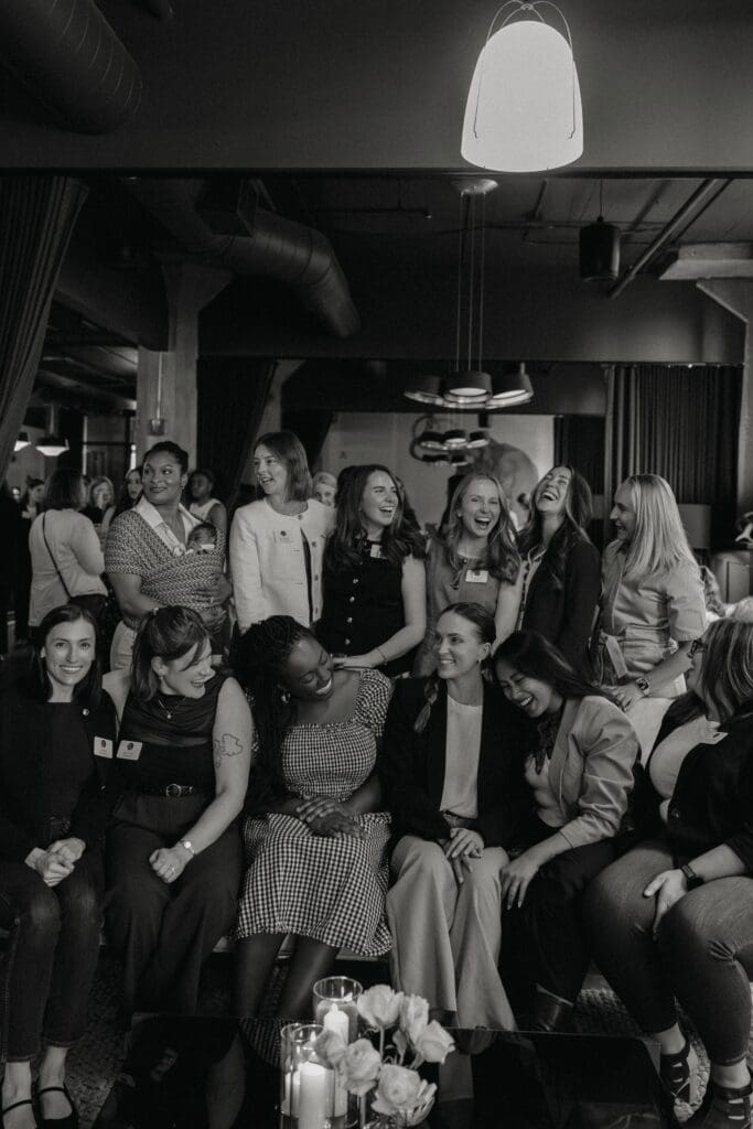Black and white photo of women in communty, emphasizing the value of running a human-first business.