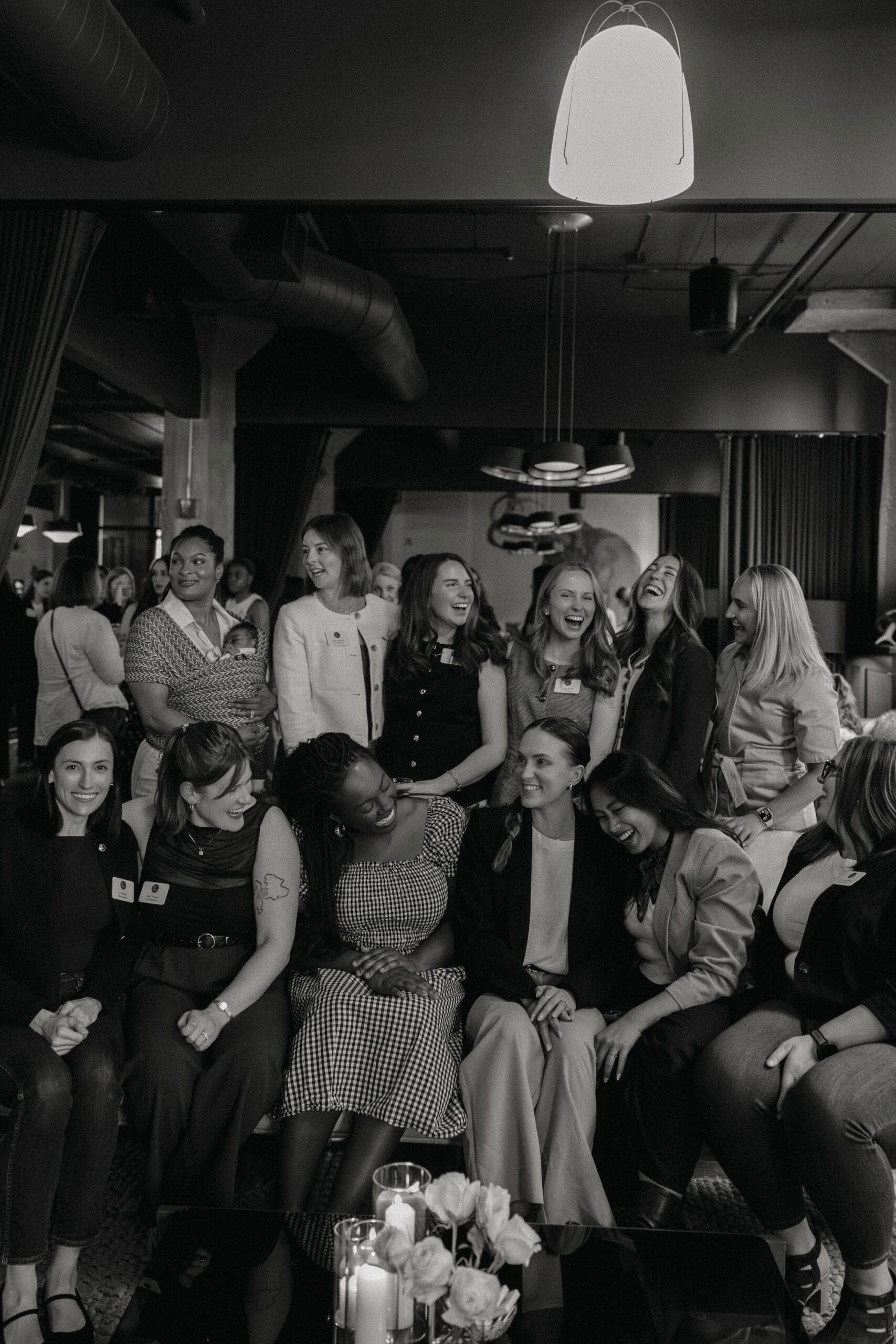 Black and white photo of women in communty, emphasizing the value of running a human-first business.
